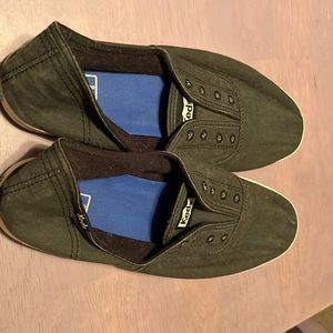 Grey Keds slide on sneakers.